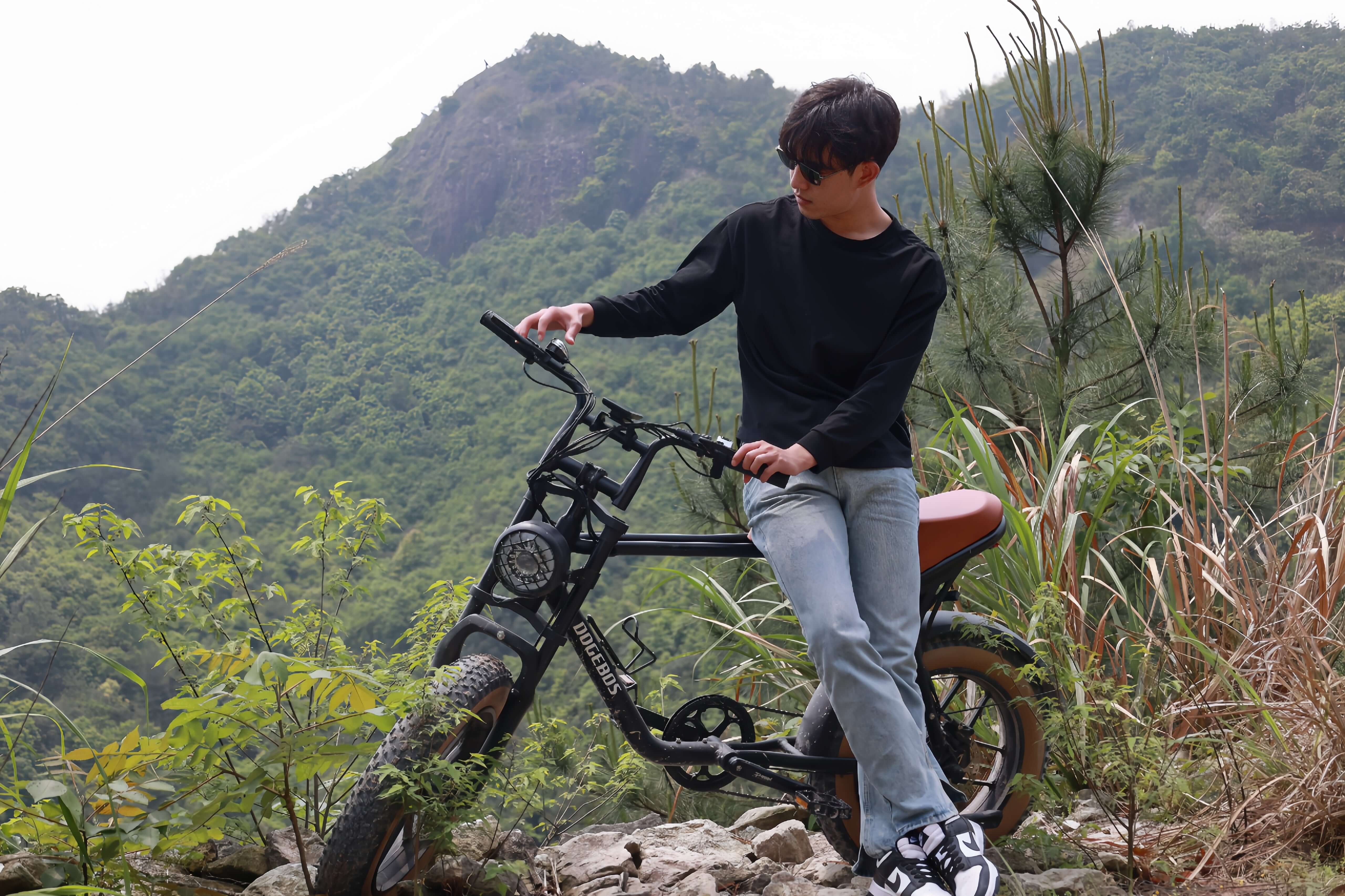 Model sitting on K3 electric bike, touching 7 gears