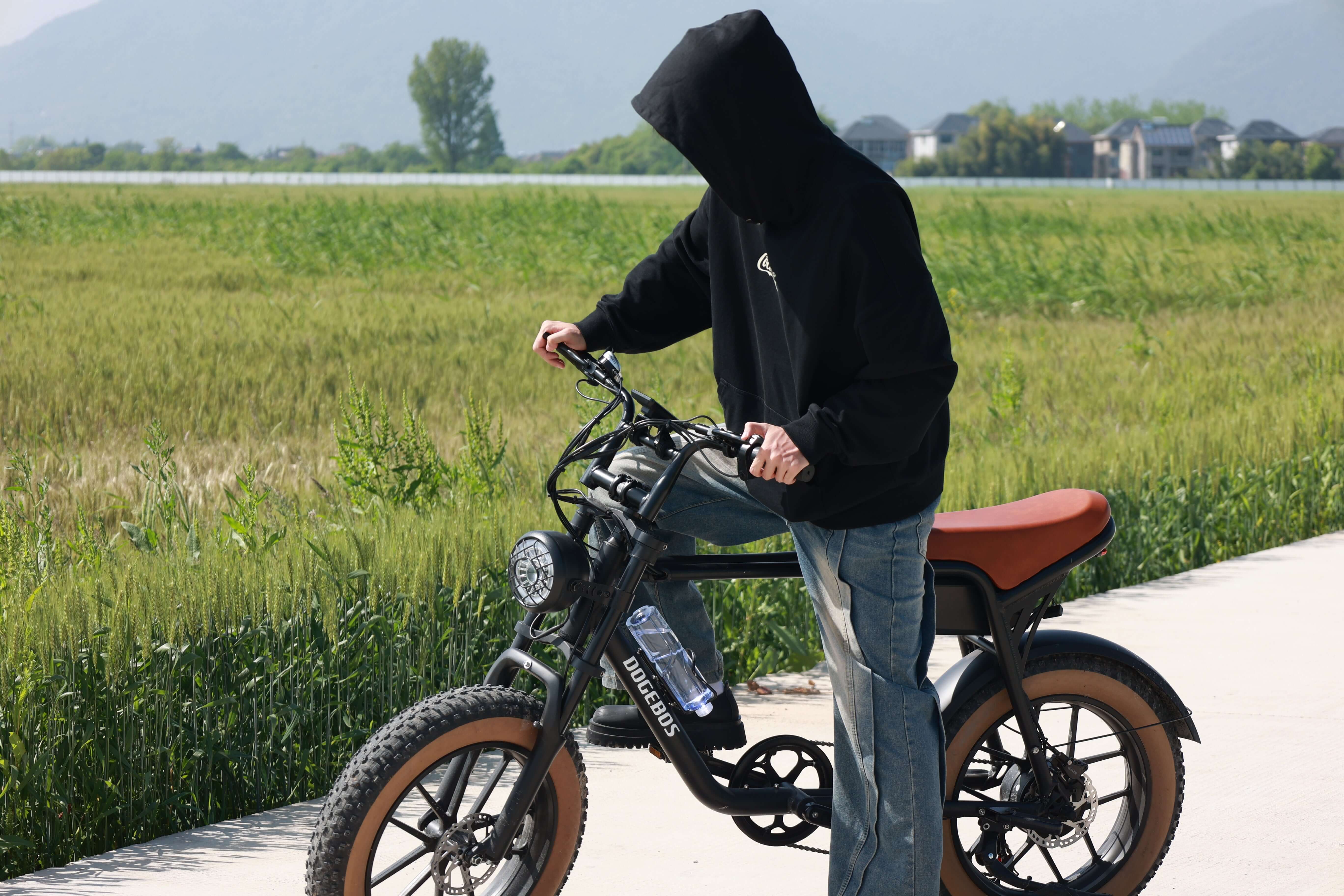 prepare to ride K3 electric bike on country side road 